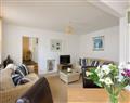 Enjoy a glass of wine at Snugglers Cove, Apartment 2; Devon