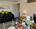 Enjoy a glass of wine at Atherton Apartments - Lawn Side; Devon