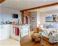 Enjoy a glass of wine at Backswood Farm Cottages - The Pottery; Devon