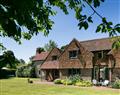 Enjoy a glass of wine at Brockwood Farmhouse and Dairy Annexe; West Meon; England