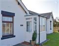Enjoy a glass of wine at Coombe Bungalow; Cumbria