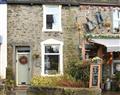 Enjoy a glass of wine at Cosy Cottage; Cumbria