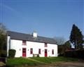 Enjoy a glass of wine at Doire Farm Cottages - Toms Cottage; Ireland
