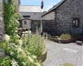 Enjoy a glass of wine at Downe Cottages - The Old Farmhouse; Devon