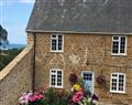 Enjoy a leisurely break at Frog by the Sea Cottage; Chideock; Dorset