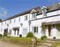 Enjoy a glass of wine at Great Trethew Manor Cottages - Trevithick Cottage; Cornwall