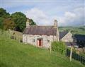 Enjoy a glass of wine at Gwernouau Cottage; Gwynedd