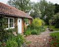 Enjoy a glass of wine at Long Gores Cottage Apartment; Norfolk