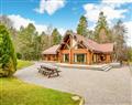 Enjoy a glass of wine at Mountain Bear Lodge; Inverness-Shire