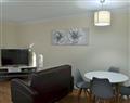 Enjoy a glass of wine at Room and Roof Serviced Apartments - Sapphire Apartment 2; Hampshire