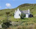 Enjoy a glass of wine at Stag Cottage; Isle Of Skye