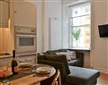 Enjoy a glass of wine at Stockbridge Apartment; Midlothian