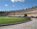 Enjoy a glass of wine at The Royal Crescent Garden Apartment; Bath; Somerset
