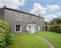 Enjoy a glass of wine at Triggabrowne Farm Cottages - The Farmhouse; Cornwall