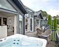 Relax in your Hot Tub with a glass of wine at East Down Lodge, Kentisbury Grange; Barnstaple; Devon
