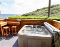 Relax in your Hot Tub with a glass of wine at 2 Cliff Cottages; ; West Portholland near Gorran Haven