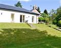 Relax in your Hot Tub with a glass of wine at Auchendennan - Ivy Cottage; Dumbartonshire