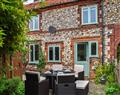 Enjoy a glass of wine at Ayres Cottage; Norfolk