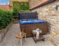 Relax in your Hot Tub with a glass of wine at Bees Cottage; North Yorkshire