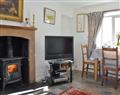 Enjoy a glass of wine at Bellman Houses - The Cottage; Cumbria