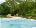 Relax in your Hot Tub with a glass of wine at Bodyddon Isaf - 3; Powys