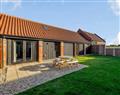 Relax in your Hot Tub with a glass of wine at Brick Kiln Barn Retreats - The Long Barn; Norfolk