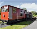 Relax in your Hot Tub with a glass of wine at Brockford Railway Sidings - The Guards Van; Suffolk
