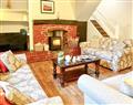 Enjoy a glass of wine at Brook House Cottage Holidays - Brook House 2; Cumbria