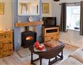 Enjoy a glass of wine at Broom Hill Cottage; Cumbria
