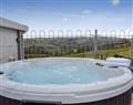 Relax in your Hot Tub with a glass of wine at Bryn Boda; Clwyd
