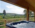 Hot Tub at Bryncoch Holidays - Woodland Lodge; Powys