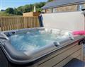 Relax in your Hot Tub with a glass of wine at Bwlch Y Person Barns -Barn 2; Dyfed