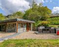 Relax in your Hot Tub with a glass of wine at Careiau Esgid; ; Corris