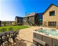 Relax in your Hot Tub with a glass of wine at Carleon Lodge; Cury near Mullion; South West Cornwall