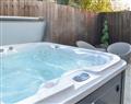 Relax in your Hot Tub with a glass of wine at Carolina Cottage; North Yorkshire