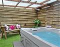 Lay in a Hot Tub at Court Farm Holiday Barns - The Stables; Gloucestershire
