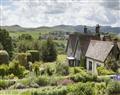 Enjoy a glass of wine at Cragside Garden Cottage; Rothbury; Northumberland
