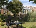 Enjoy a glass of wine at Dell Cottage; Norfolk