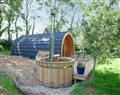 Relax in your Hot Tub with a glass of wine at Devon Glamping - Glamping Pod 1; Devon