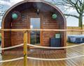 Relax in your Hot Tub with a glass of wine at Four Falls - Erin Pod; Powys