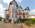 Enjoy a glass of wine at Garden Apartment No1; ; Rhos-On-Sea