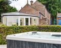 Relax in your Hot Tub with a glass of wine at Garth House - Garth Cottage; Cumbria