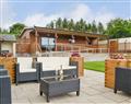 Relax in your Hot Tub with a glass of wine at Gatra Farm Lodges - Blake Fell Lodge; Cumbria