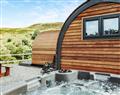 Relax in your Hot Tub with a glass of wine at Glampio Tryso Derwen; Gwynedd