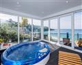 Relax in your Hot Tub with a glass of wine at Glas Mordros; Cornwall