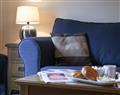 Enjoy a glass of wine at Glen Mhor Apartment 5; Inverness-Shire