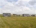 Enjoy a glass of wine at Glenegedale Airpods - Islay Airport Pod Two; Isle Of Islay