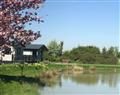 Relax in your Hot Tub with a glass of wine at Grange Farm Park - Poppy Lodge; Lincolnshire