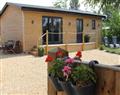 Relax in your Hot Tub with a glass of wine at Greenways Log Cabin; ; Newent
