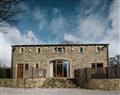 Relax in your Hot Tub with a glass of wine at Hargreaves Head Holiday Cottages - Sycamore Barn; West Yorkshire
